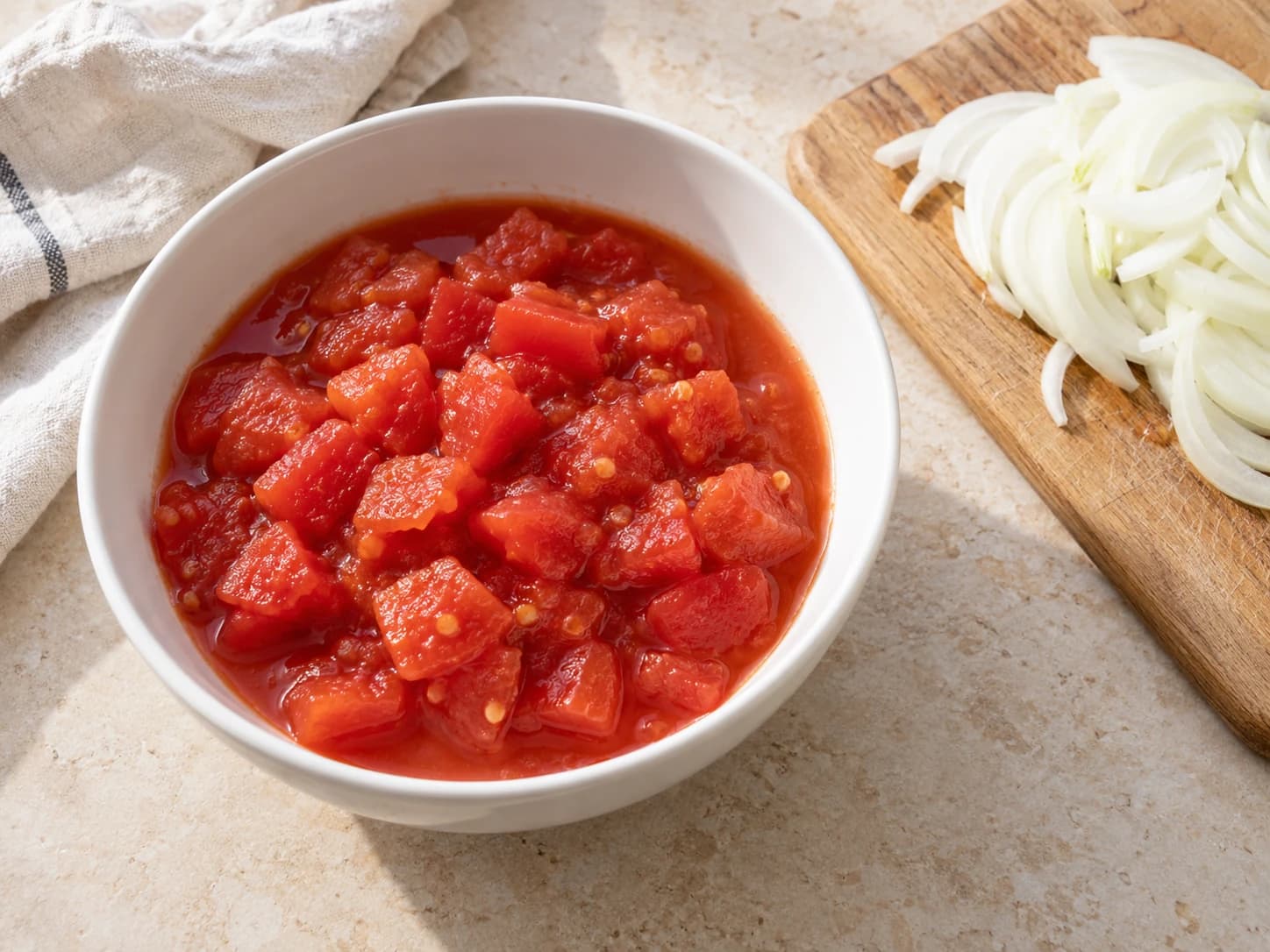 Chopped canned tomatoes and thinly sliced onion.